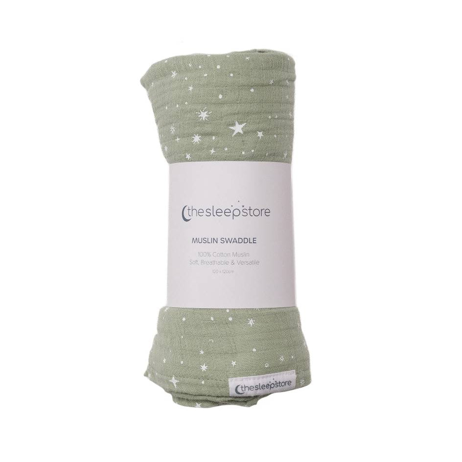 Green muslin swaddle with white star pattern and 'thesleepstore' label on a white background