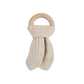 Beige cotton muslin teething ring with wooden handle on a white background
