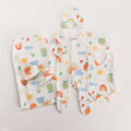 Rainbow gift pack with onesie, singletsuit booties, beanie and swaddle on white background