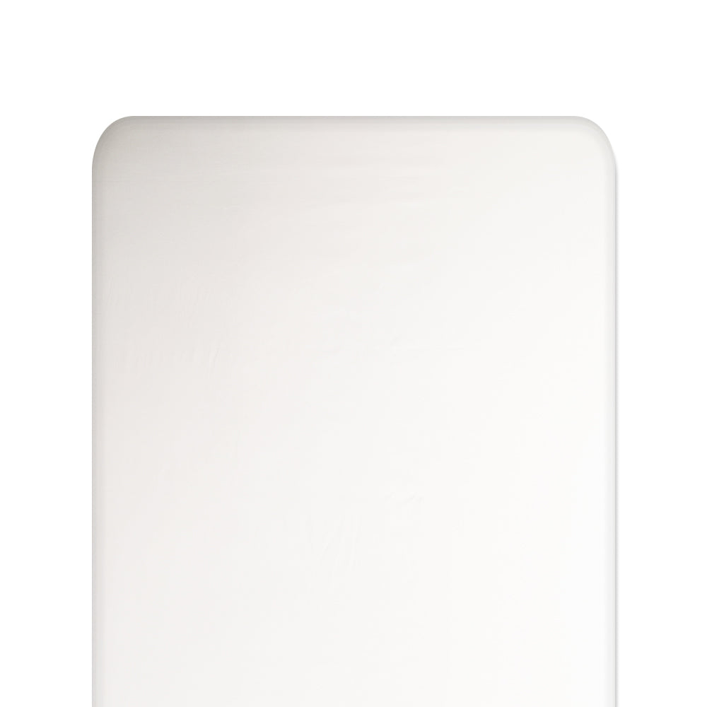 Ivory silk fitted sheet on a white background