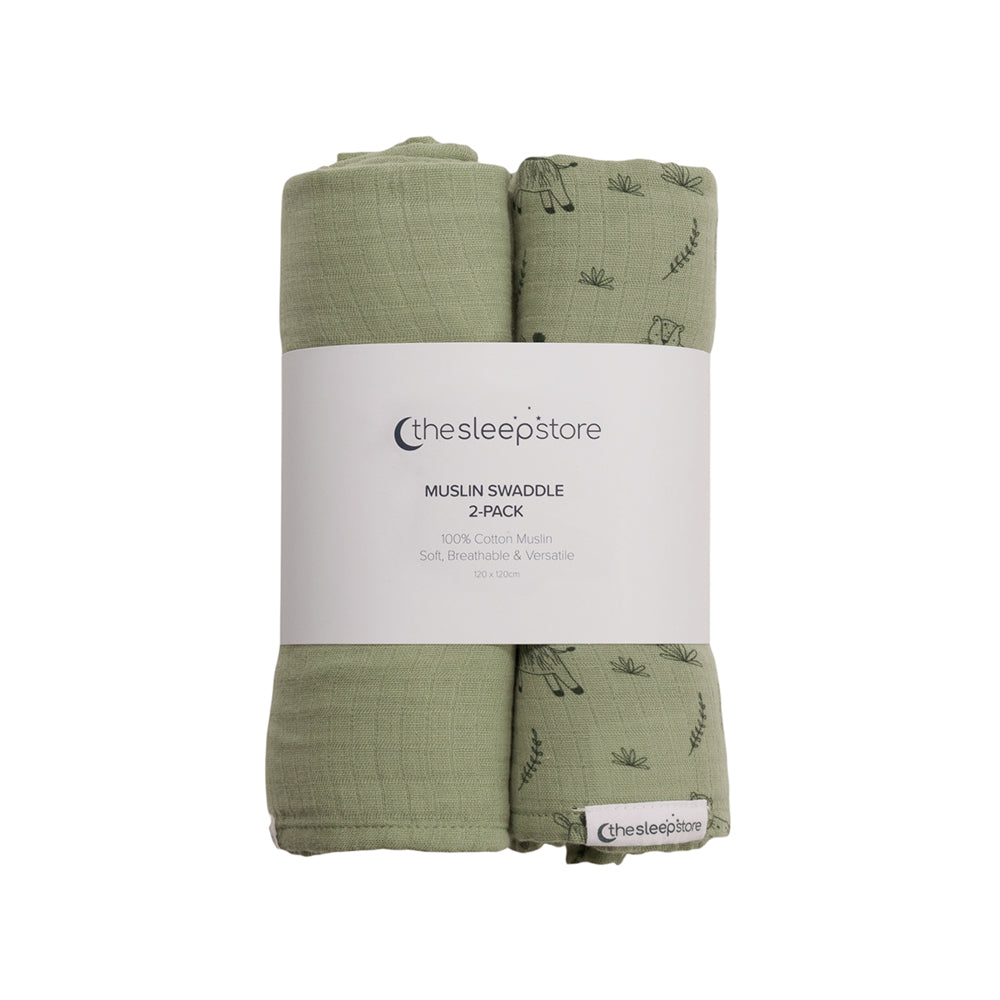 Two green muslin swaddles with a white label on a white background