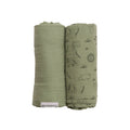 Two green swaddles with animal prints on a white background