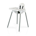 White plastic high chair with gray legs and black straps on a white background