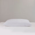 White pillow on a light gray background