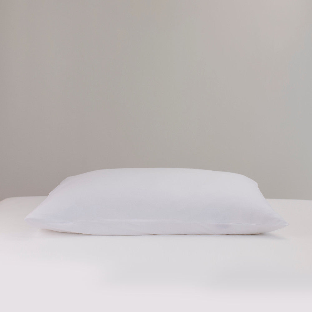 White pillow on a light gray background