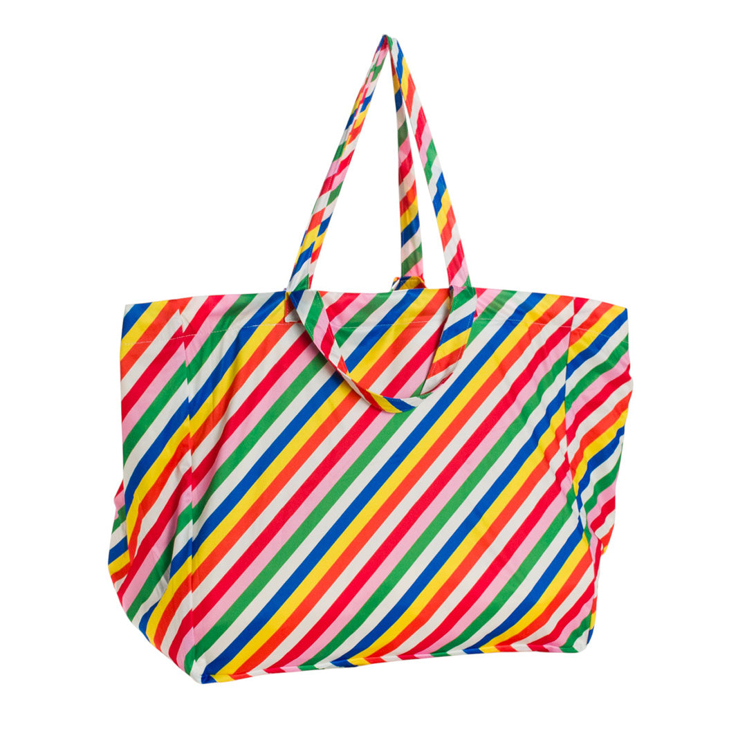 Colorful striped Nestling tote style beach bag on a white background