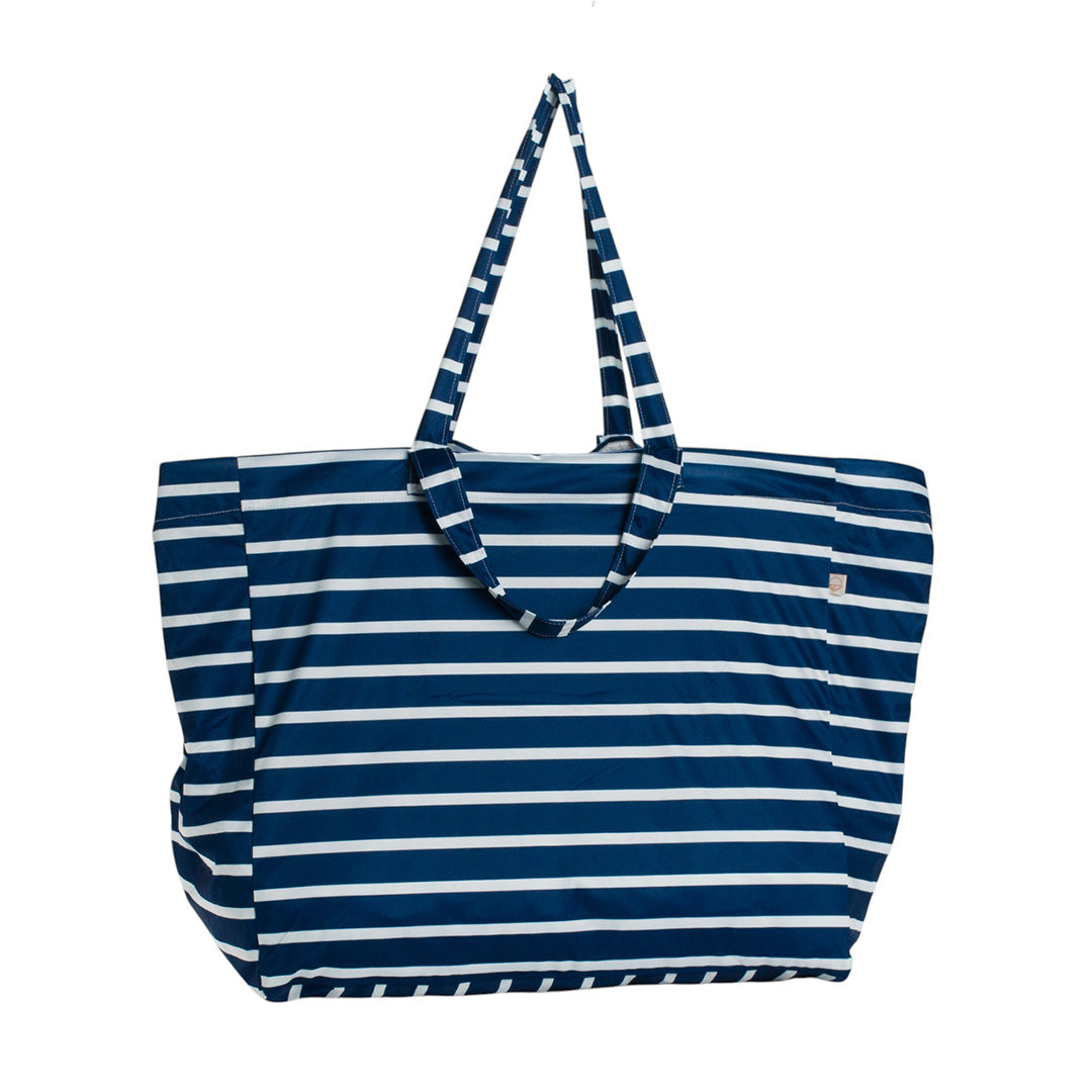 Blue and white striped tote style Nestling beach bag on a white background