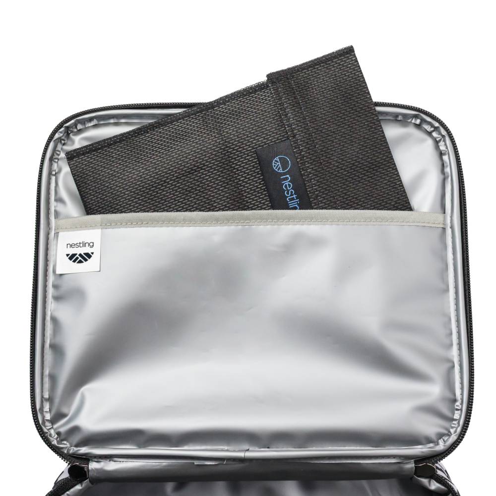 Silver insulated lunch bag with a black mesh ice pack pouch inside on a white background