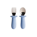 Nestling baby cutlery set of fork and spoon with blue silicone handles on a white background