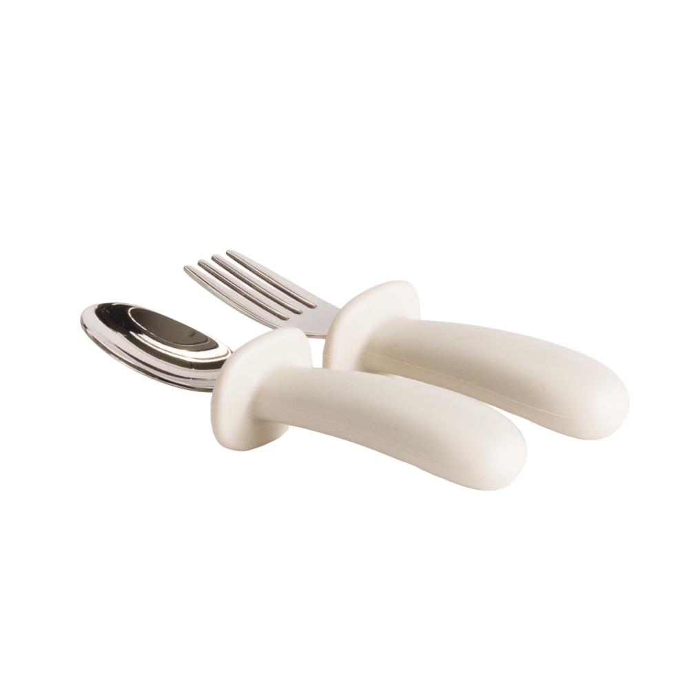 Set of Nestling baby cutlery with oat handles on a white background