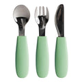 Set of three utensils, spoon, fork and knife with green handles on a white background