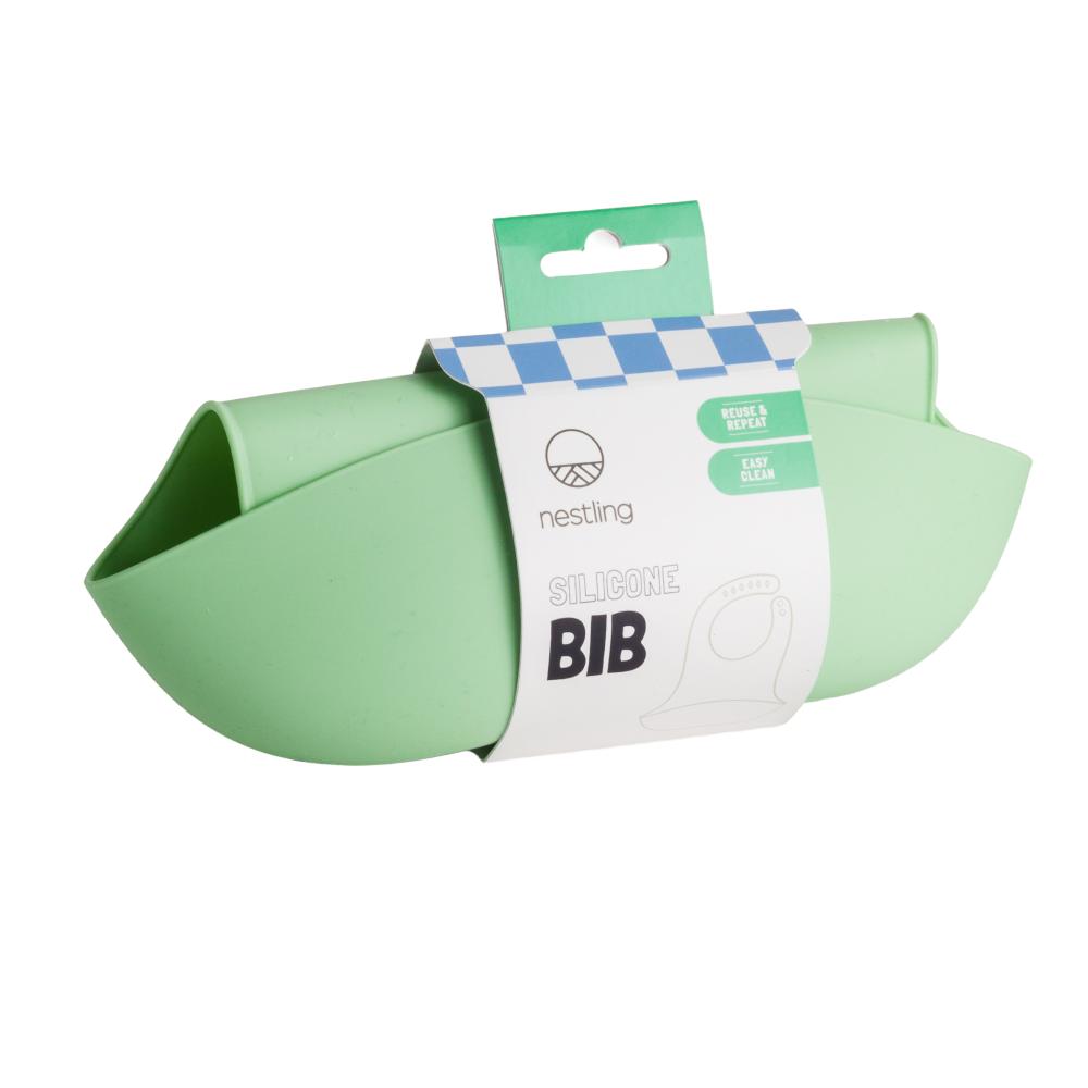 Green silicone bib with Nestling brand packaging on a white background