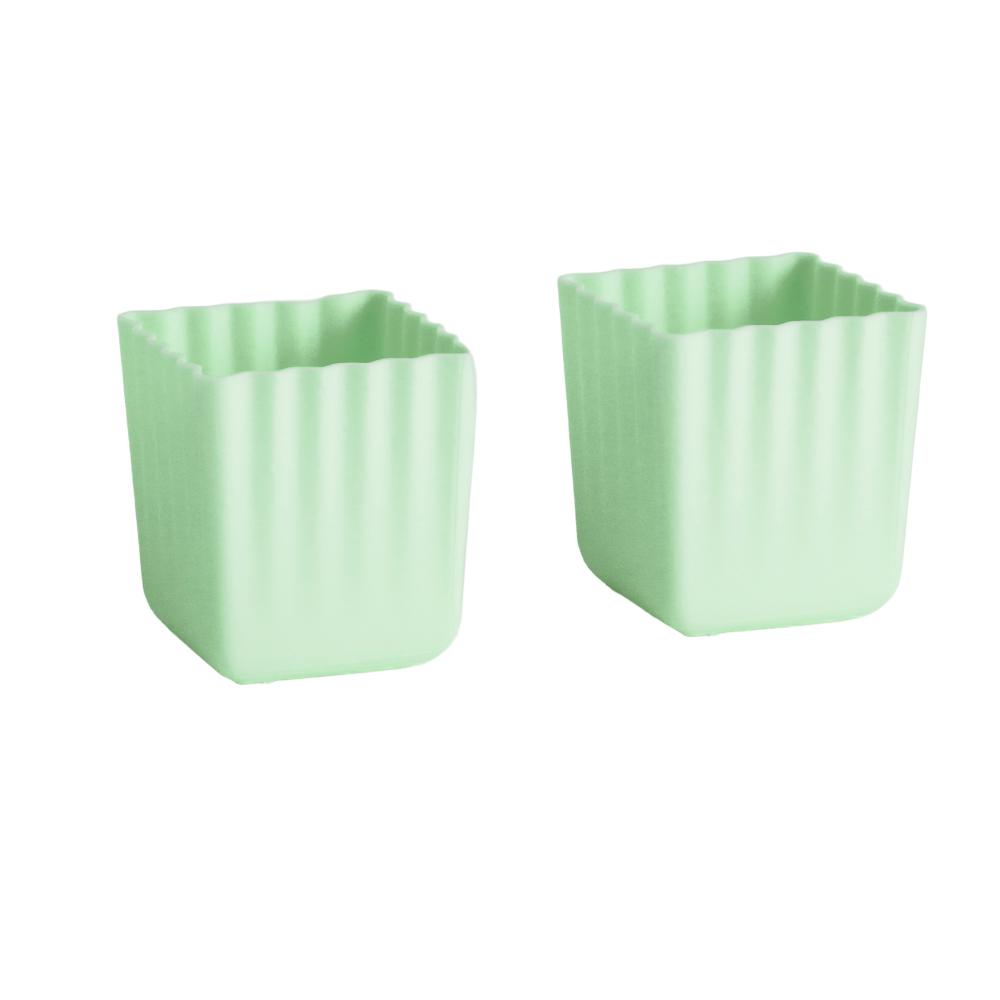 2 large green silicone cups on a white background