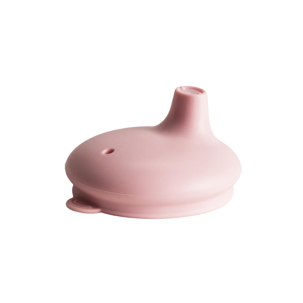 Pink Nestling silicone sippy cup lid on a white background