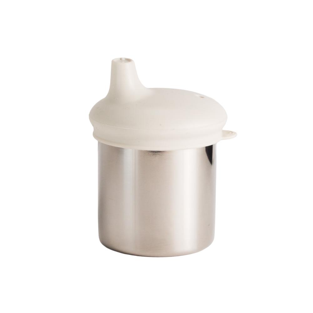 Nestling stainless steel cup with a silicone sippy cup lid with a white lid on a white background