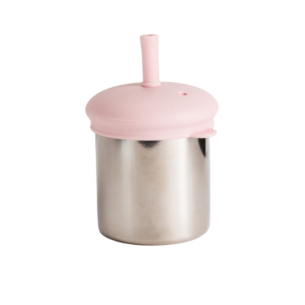 Pink silicone lid with straw on a stainless steel cup against a white background