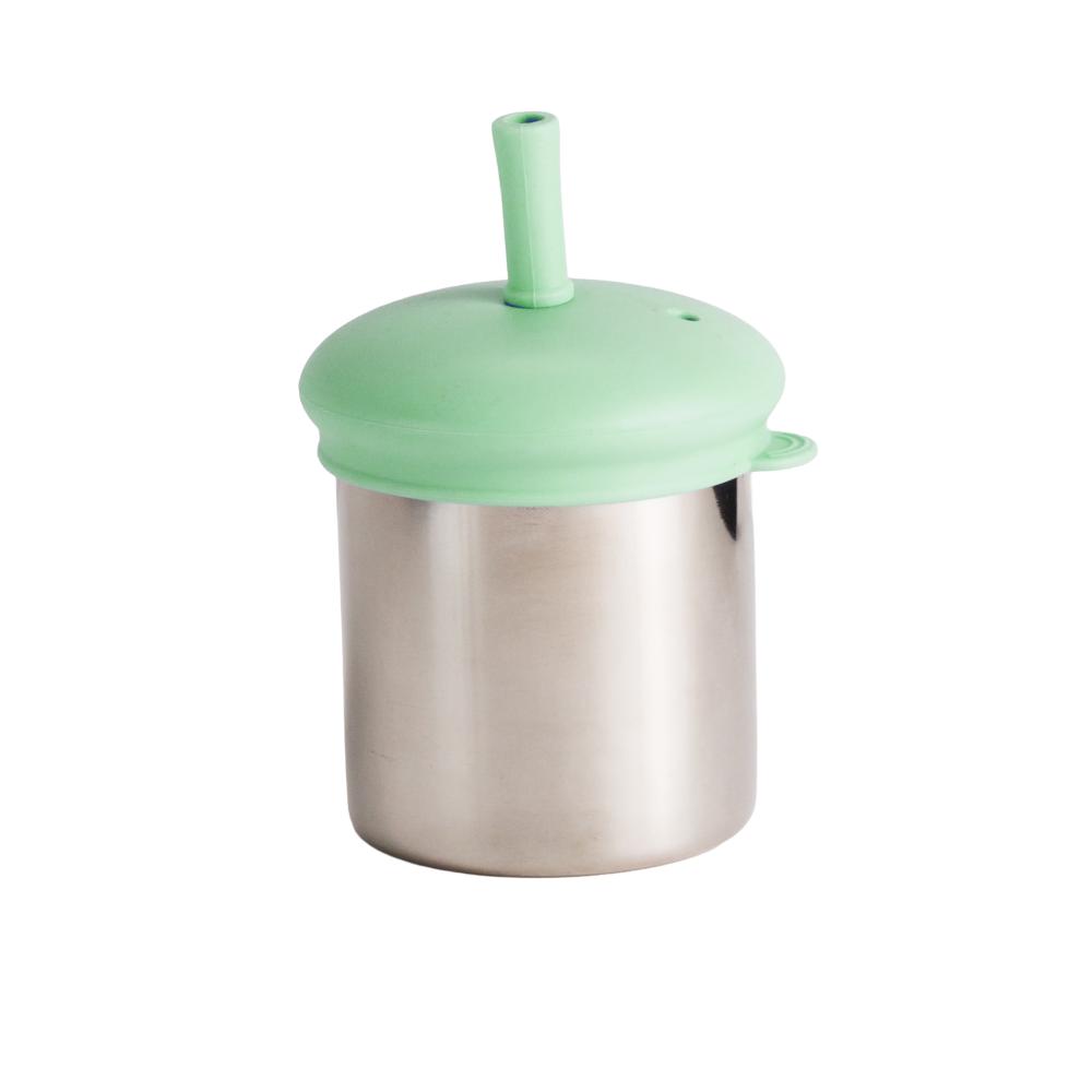Metallic stainless steel cup with a green silicone lid with straw on a white background