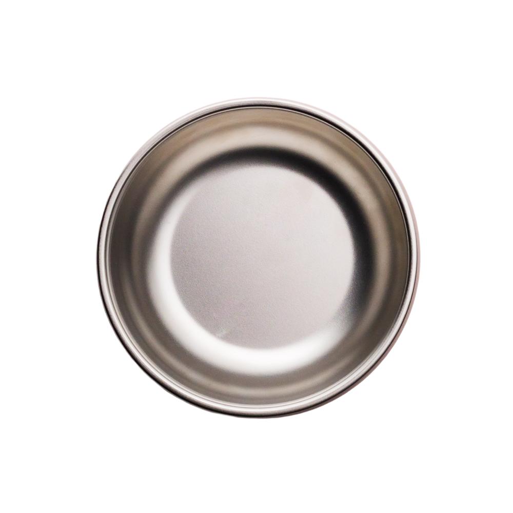 Stainless steel bowl and silicone suction bowl on a white background