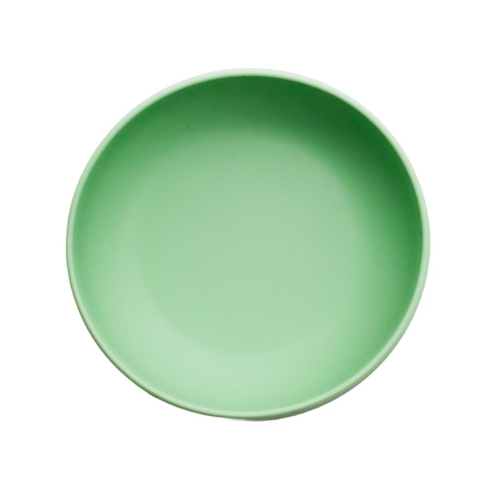 Green silicone bowl cover on a white background