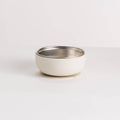 White stainless steel and silicone baby bowl on a white background