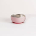 Pink silicone and stainless steel baby feeding bowl on a white background