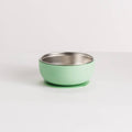 Green stainless steel and silicone baby bowl on a white background