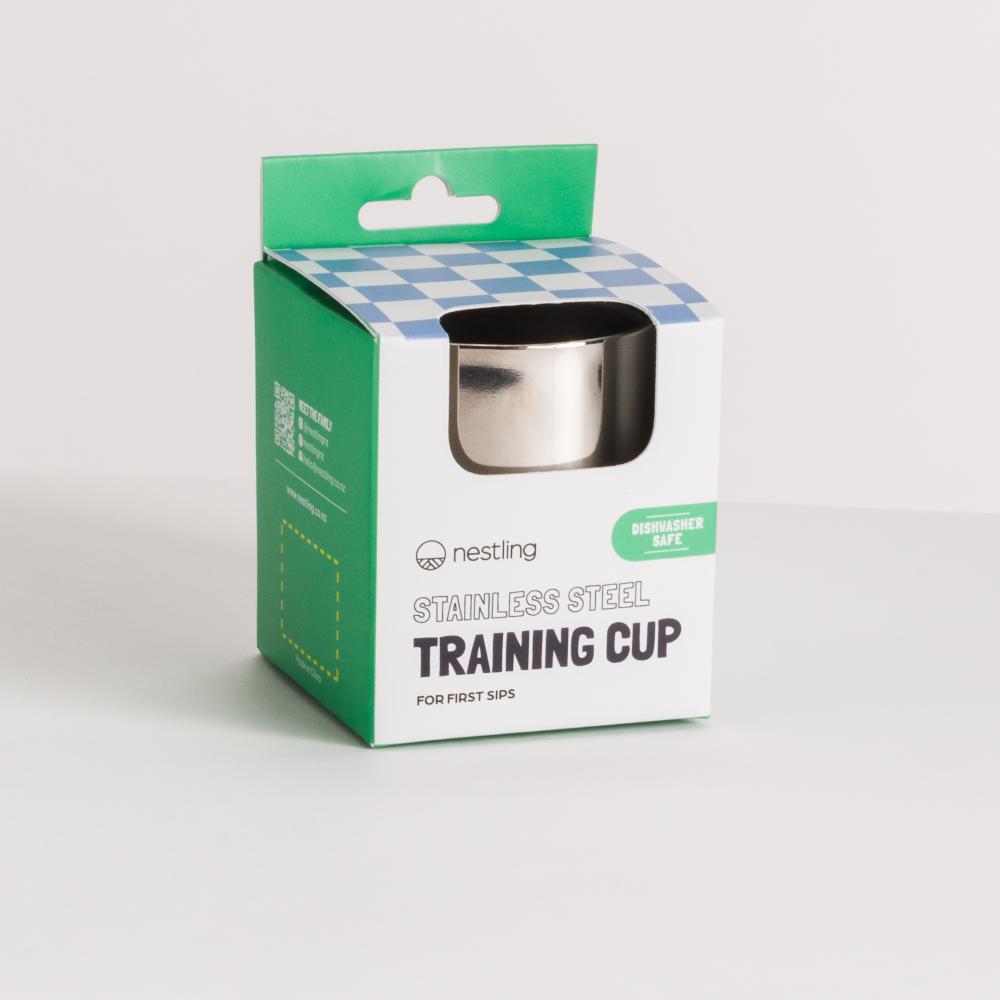 Stainless steel training cup for toddlers in Nestling brand packaging with green and white design
