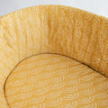 Yellow sunshine print fitted sheet on a mattress inside a moses basket. 