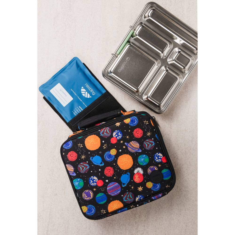 A black insulated lunch bag with a colorful space-themed print of planets and stars, alongside a blue ice pack and a stainless steel bento box.