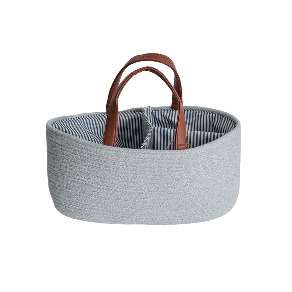 Grey cotton woven basket with brown faux leather handles and striped inner on a white background