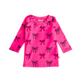 Neon Swim Rash Shirt in Pink Bows pattern on a white background