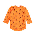 Orange long-sleeve swim rash vest with orange palms patterns on a white background
