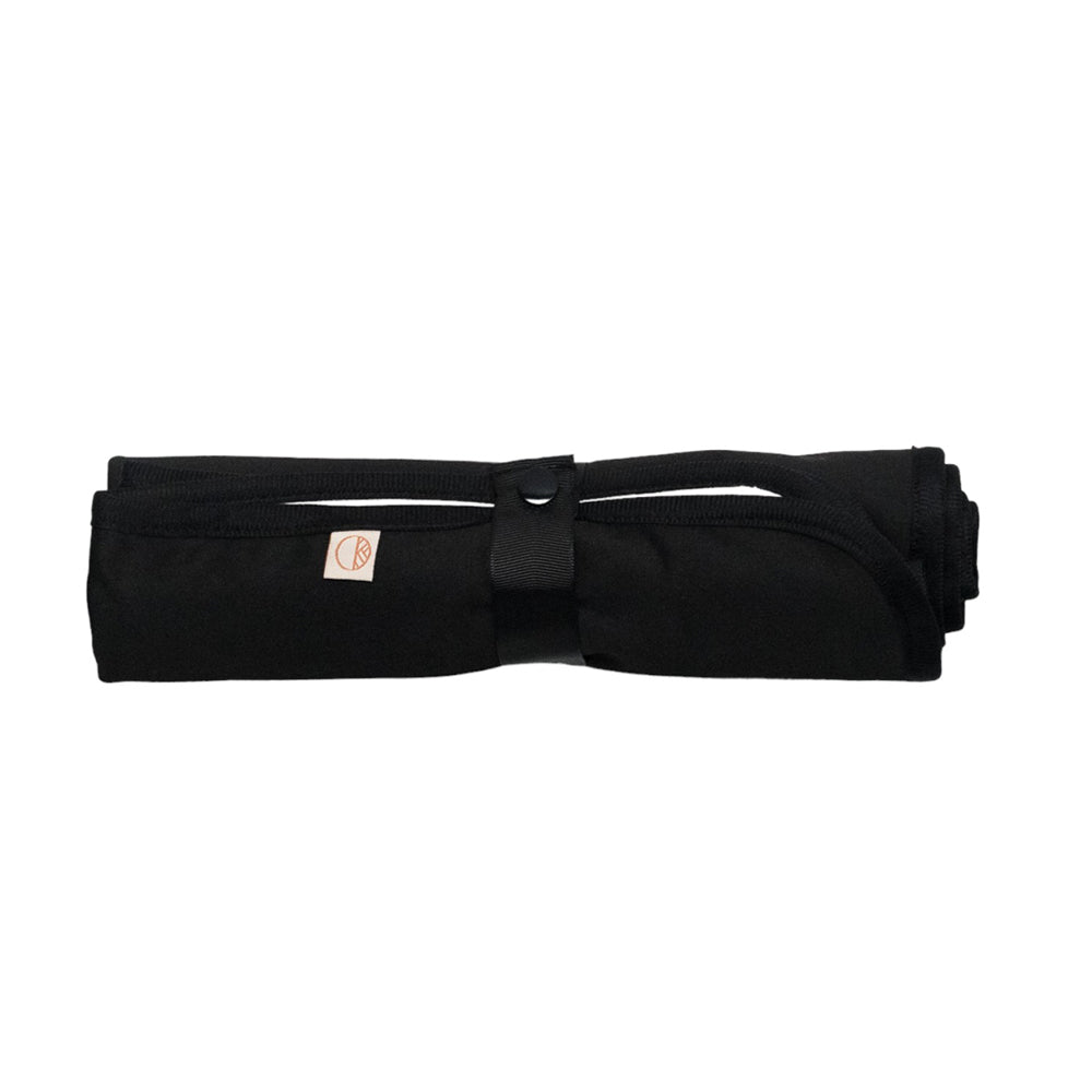 Nestling out & about change mat rolled up and secured with a snap
