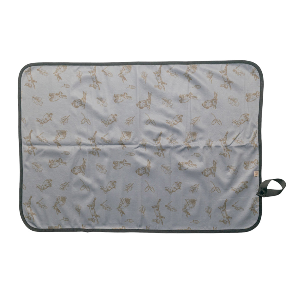 Rabbit patterned out & about change mat on a light gray background