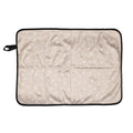 Beige waterproof portable change mat with white sunshine print on a white background