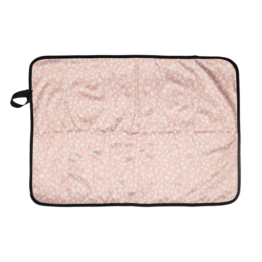 Floral ditsy patterned portable change mat with a black border on a white background