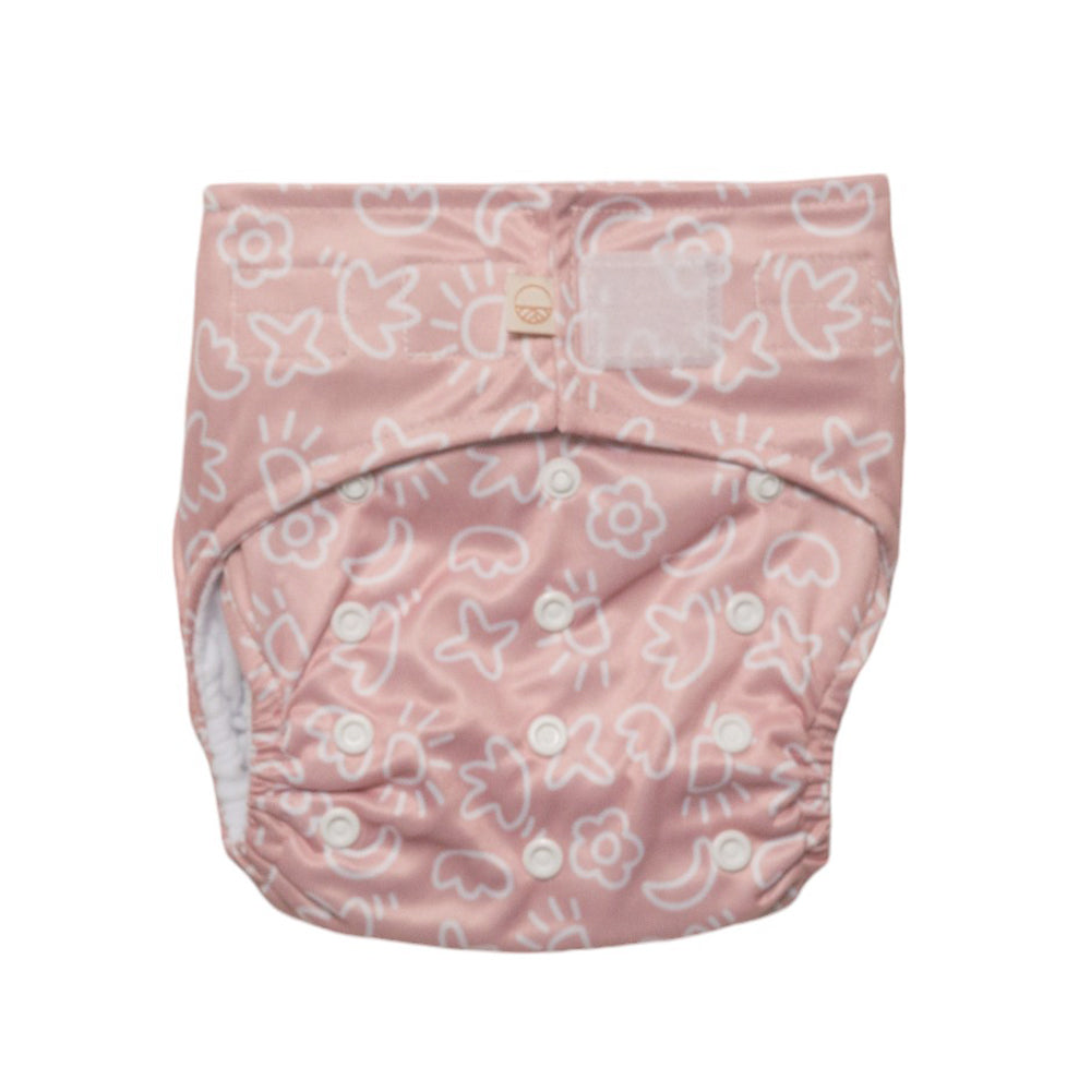 Reusuable nappy with velcro and snaps in pink art design on a white background