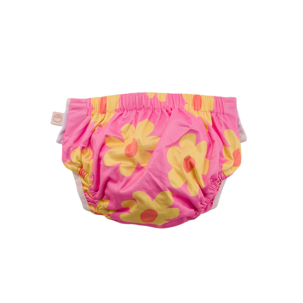 Pink Nestling swim nappy with yellow flowers on a white background