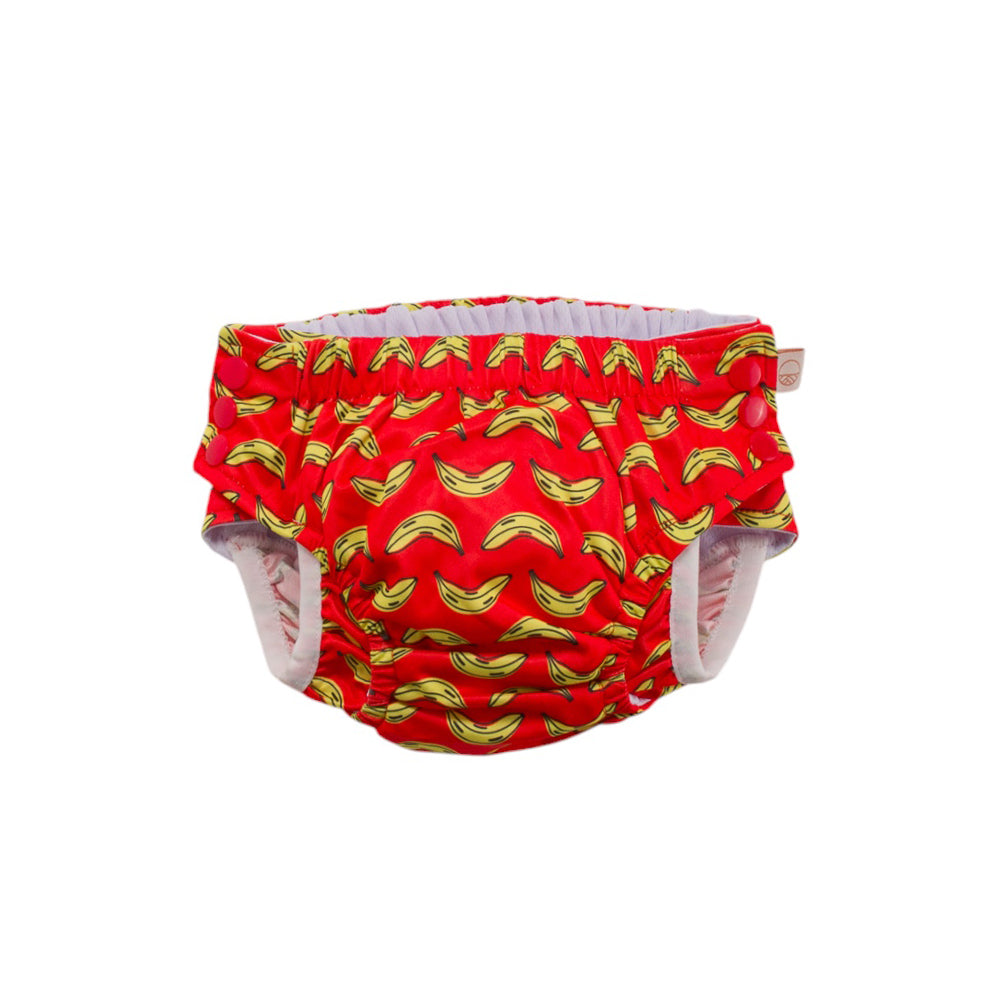 Red reusable swim nappy with a yellow banana pattern on a white background
