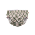 Green and white checkered baby swim nappy on a white background