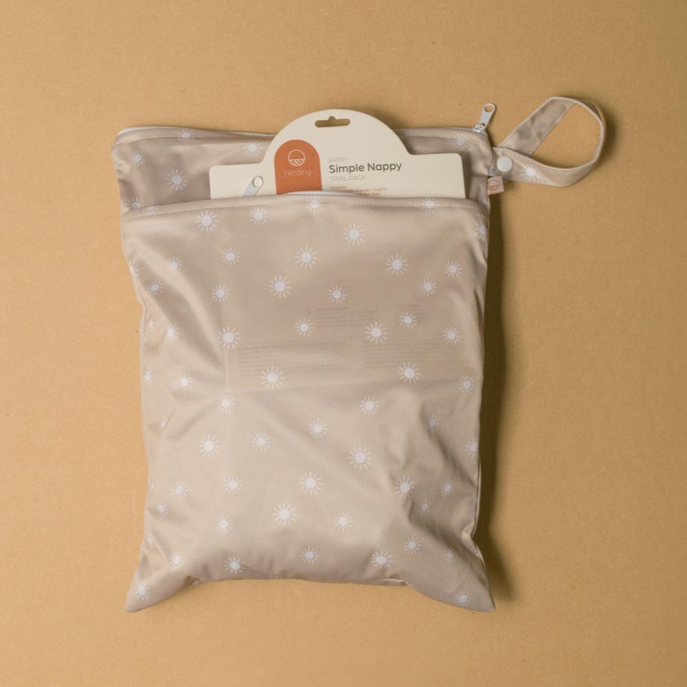 Beige nappy bag with white star pattern on a beige background