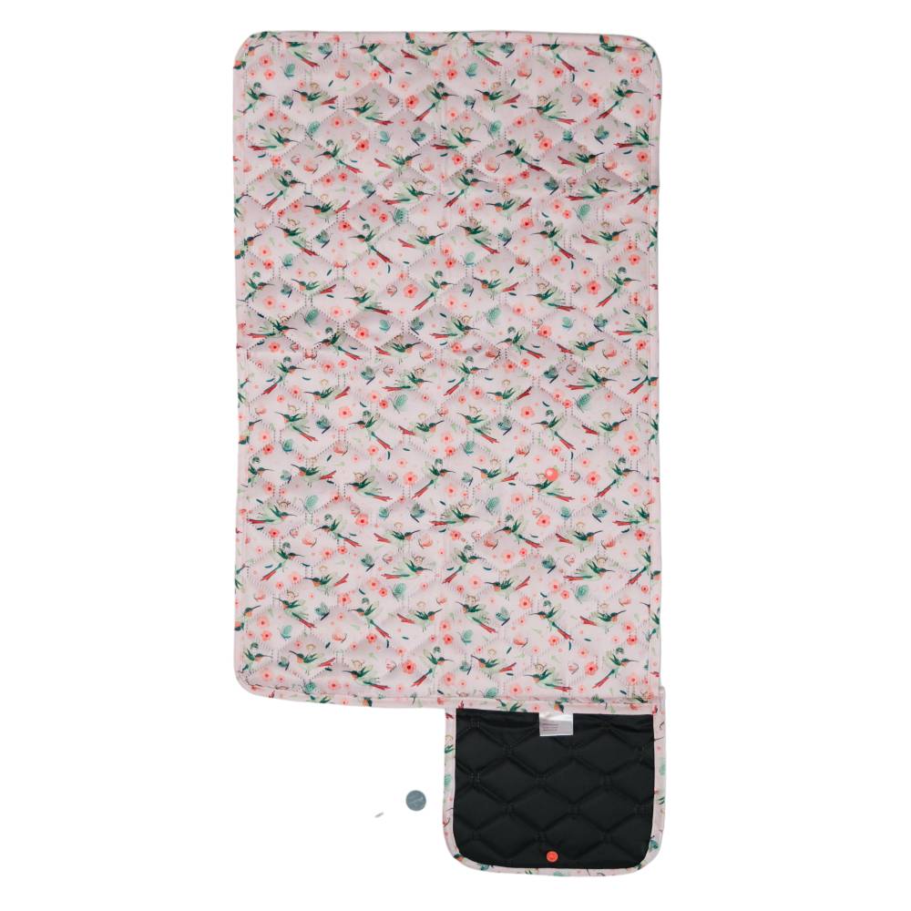 Floral-patterned changing pad with a black bottom section on a white background