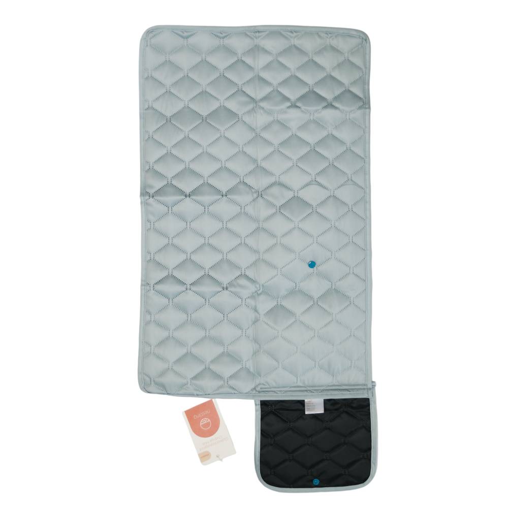 Quilted waterproof change mat in sage colour on a white background