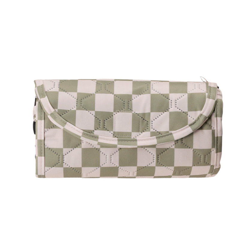 Checkered sage green play mat with green and white pattern on a white background