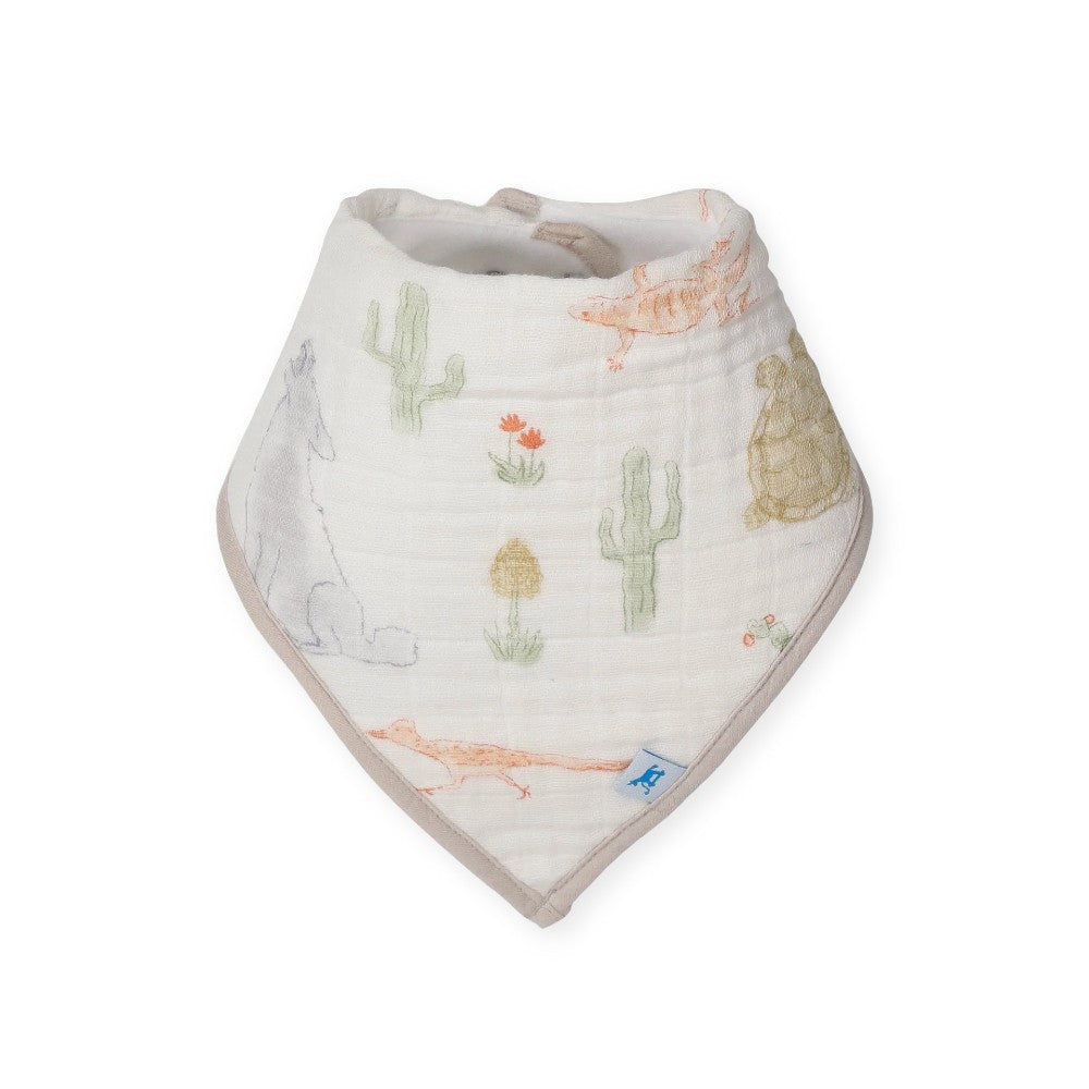 Cotton muslin Baby bandana bib with white desert animal design on a white background