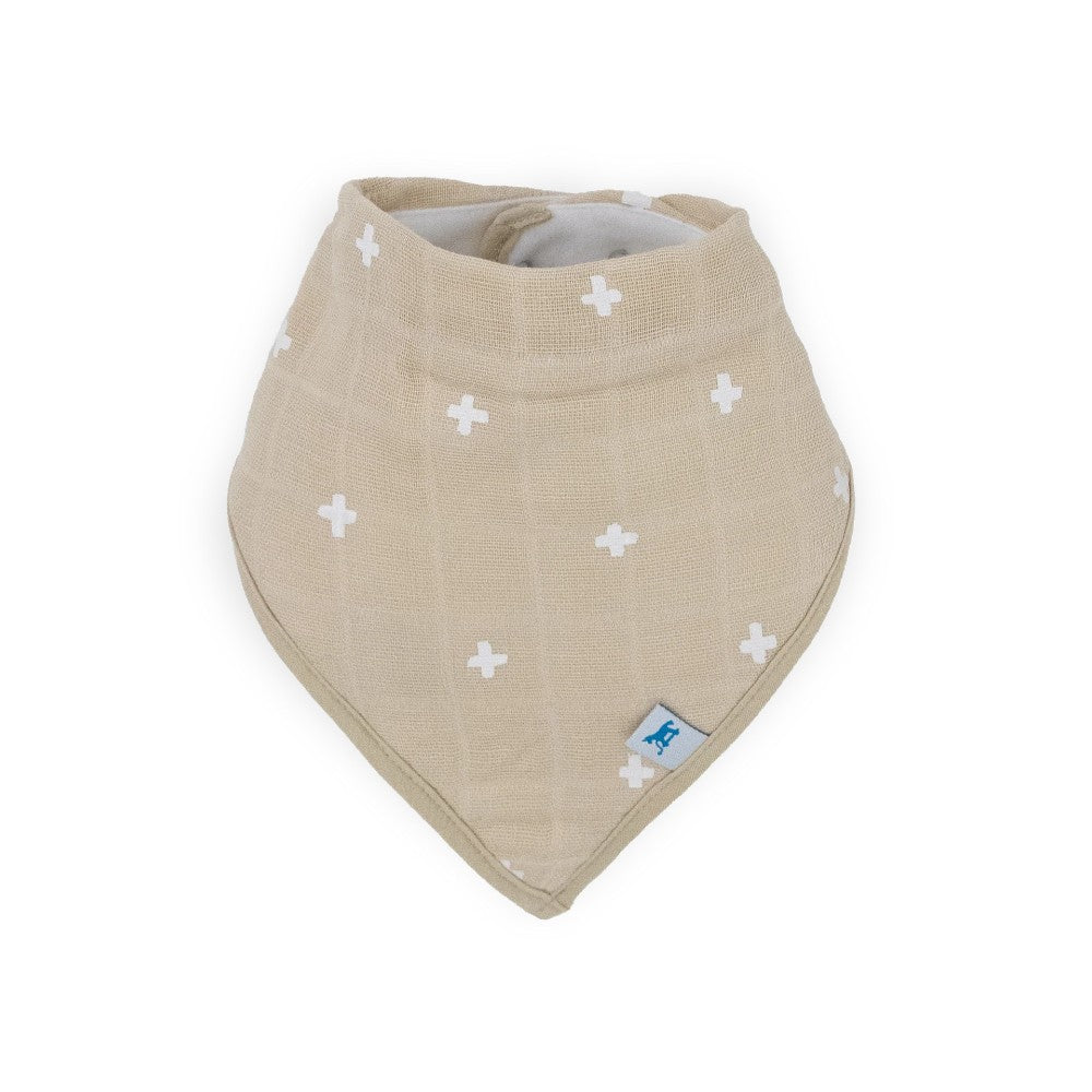 Beige muslin baby bandana bib with white cross patterns on a white background