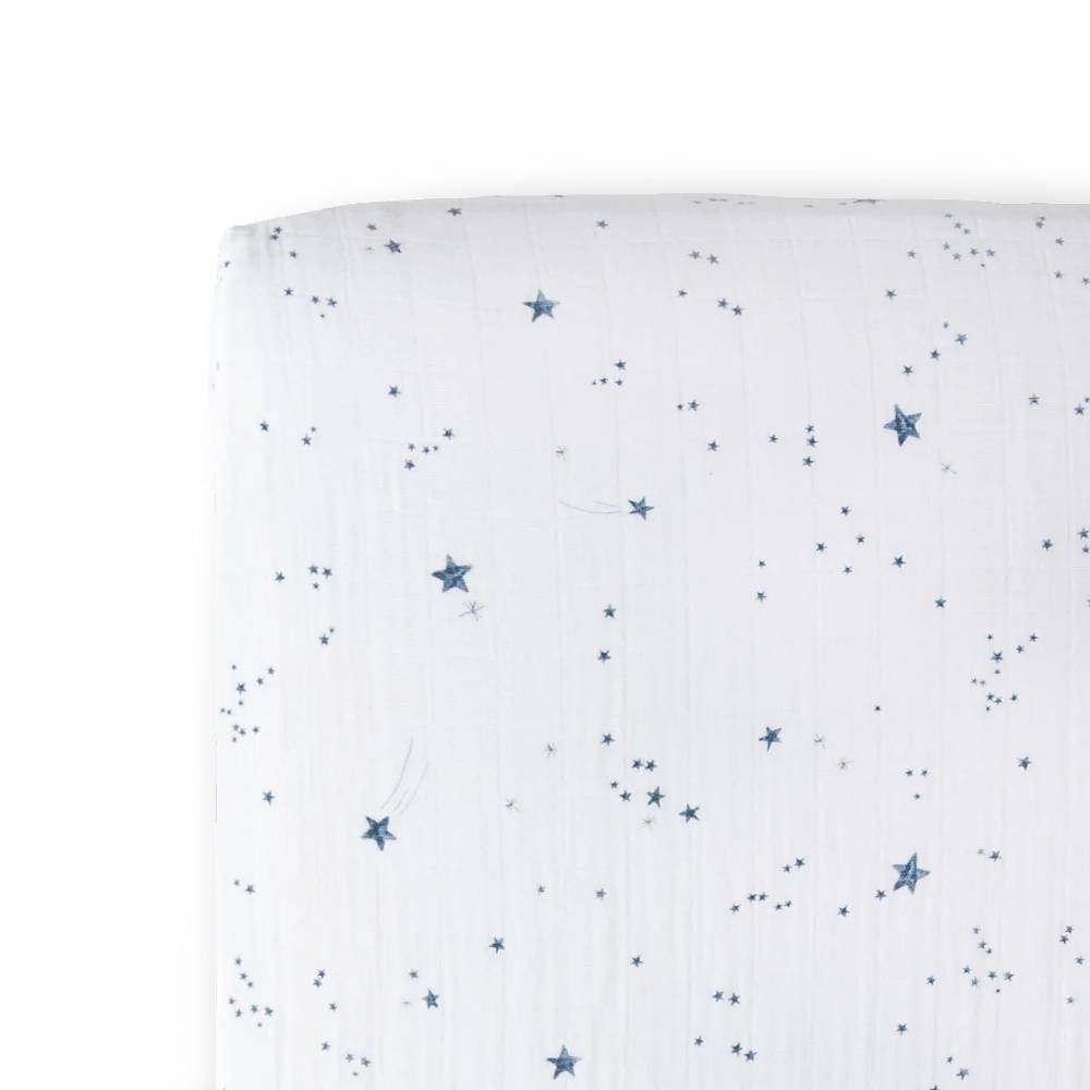 cotton muslin fitted sheet with navy blue star pattern on a white background