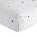 Close-Up cotton muslin fitted sheet with navy blue star pattern on a white background