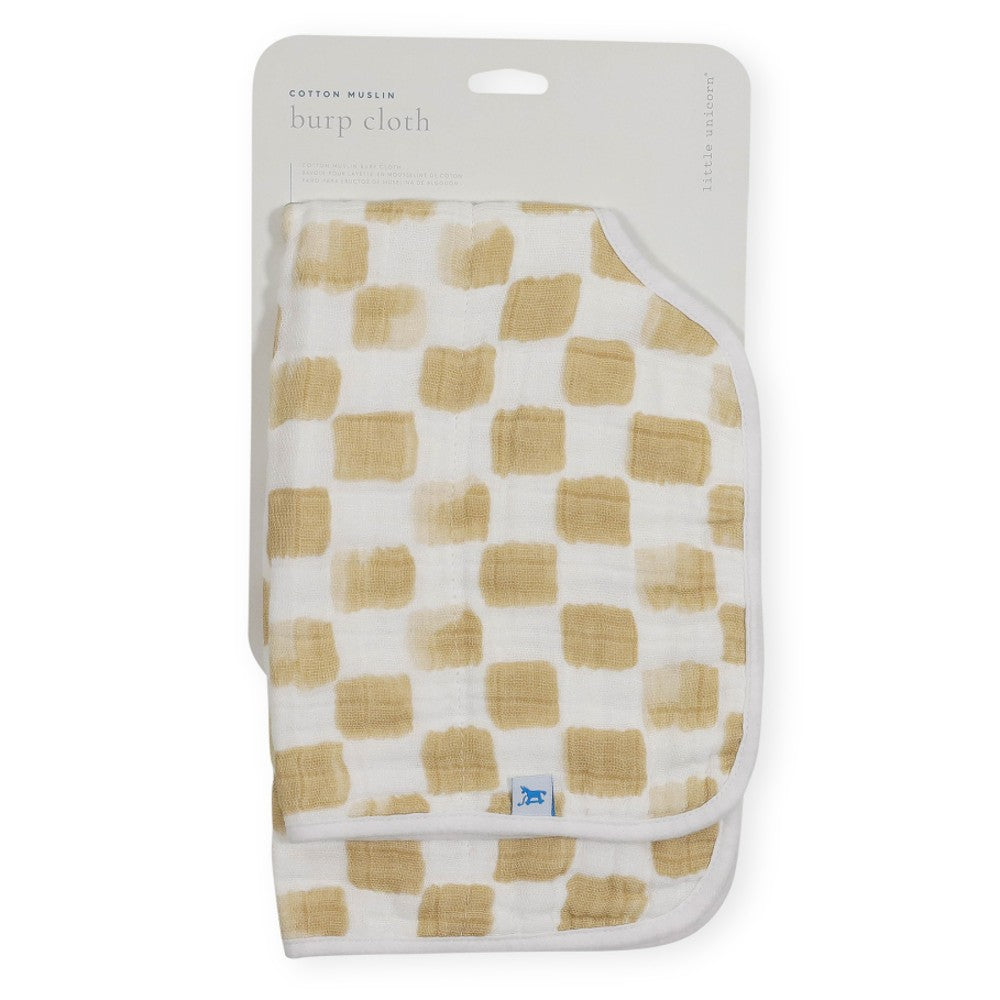 Beige and white checkered muslin burp cloth in packaging on a white background