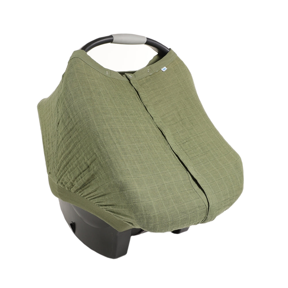 Green cotton muslin baby car seat cover on a white background